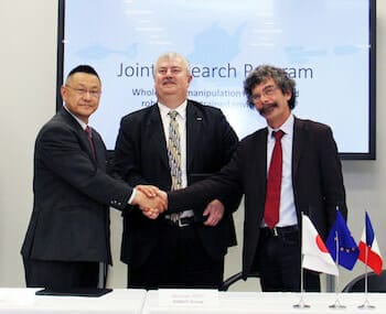 Project partners at the official signing ceremony and project launch at the AIST campus in Tsukuba. Japan: From left to right, Satoshi Sekiguchi, AIST; Sébastien Remy, AGI; Jean-Yves Marzin, CNRS-INSIS. © AIST